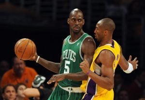 Boston Celtics Kevin Garnett (L) is defe