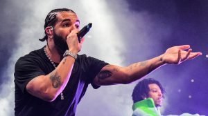 Drake/ Checks Concert Goer, Music/ Music Industry/ Entertainment/ Landon Buford The Journalist/LandonBuford.com