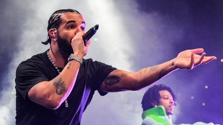 Drake/ Checks Concert Goer, Music/ Music Industry/ Entertainment/ Landon Buford The Journalist/LandonBuford.com