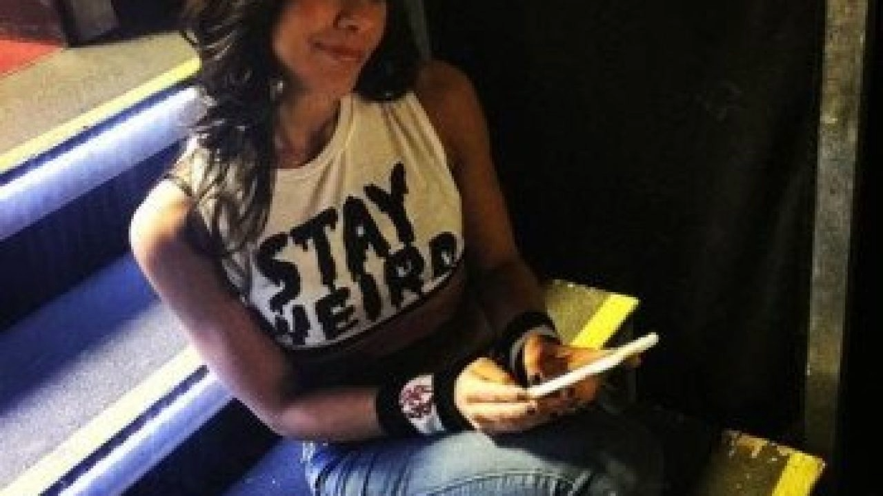 Kai Raxx, an artist with a focused expression, stands against a backdrop that reflects the moody and atmospheric vibe of his single "Indica". LandonBufor.com