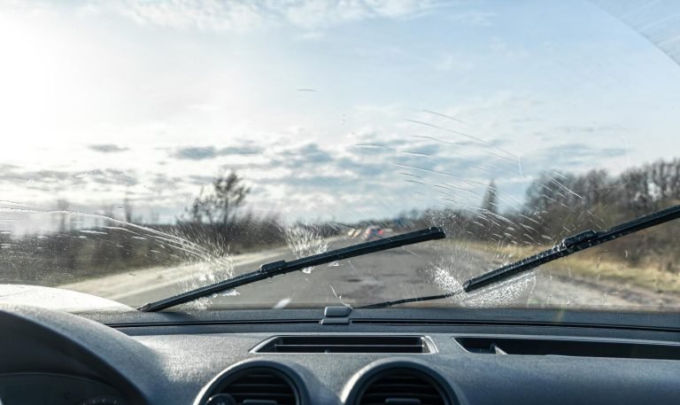 car-wipers-clean-windshields-when-driving-sunny-weather_169016-18171