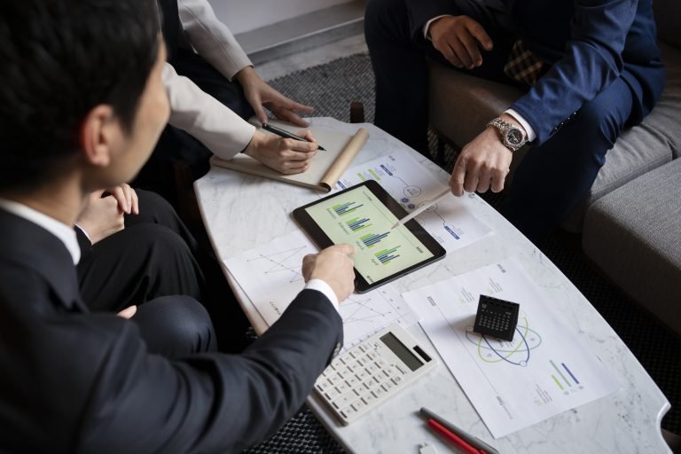 business-people-working-with-ipad-high-angle