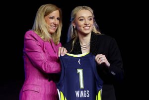 Paige Bueckers poses with WNBA Commissioner Cathy Engelbert after being selected as the first LandonBuford.com