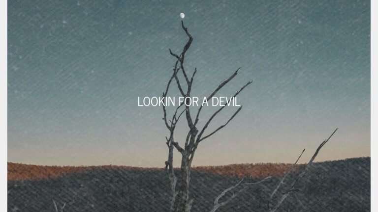 Ben Gage performing his new single “Lookin’ for a Devil” with guitar in hand.