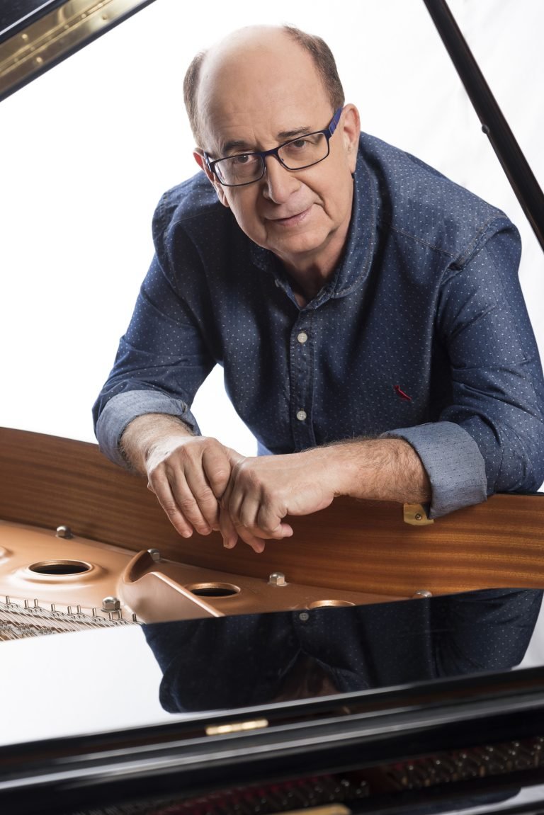 Antonio Adolfo plays piano in a warmly lit studio as he reimagines the Brazilian classic "Vai Passar." LandonBuford.com