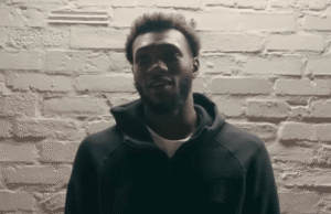 Moussa Cissé in a Dallas Mavericks practice or game setting, highlighting his length and defensive presence.