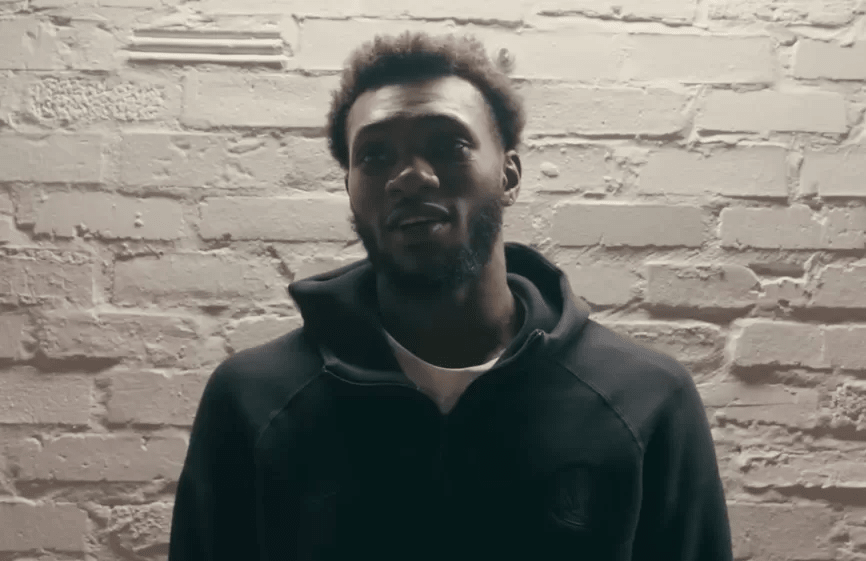 Moussa Cissé in a Dallas Mavericks practice or game setting, highlighting his length and defensive presence.