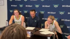 Paige Bueckers smiling during a media interview after responding to Subaru’s car sponsorship offer.