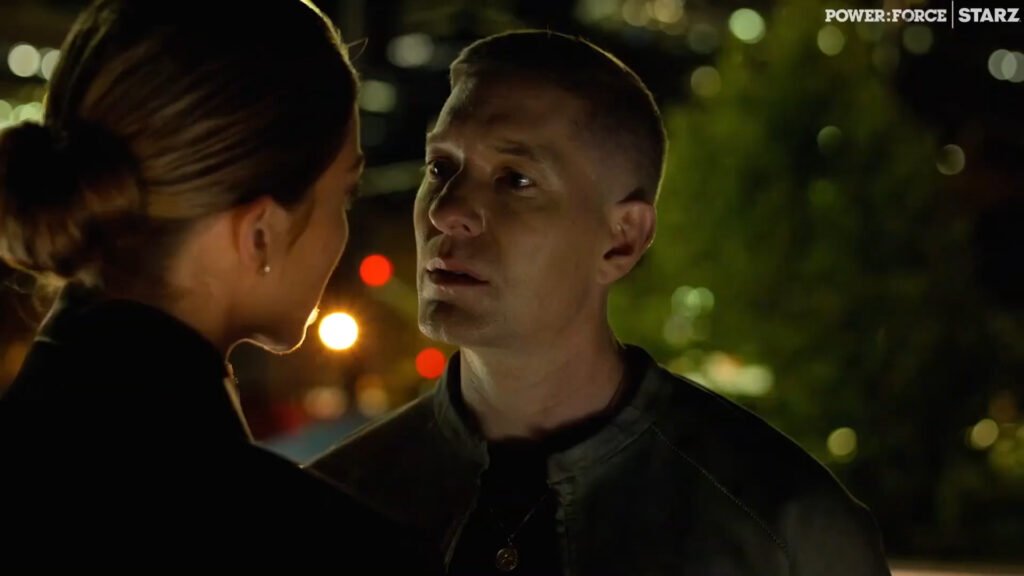 Claudia Flynn having a tense conversation in prison.