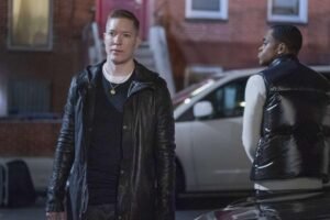 Tommy Egan looking intense while holding a phone in Power Book IV Force Season 3