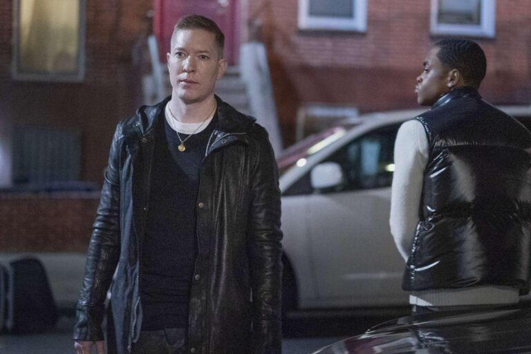 Tommy Egan looking intense while holding a phone in Power Book IV Force Season 3