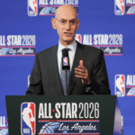 NBA Commissioner Adam Silver speaking at a press conference, waves and gestures while discussing potential league expansion with Seattle and Las Vegas mentioned as possible future teams
