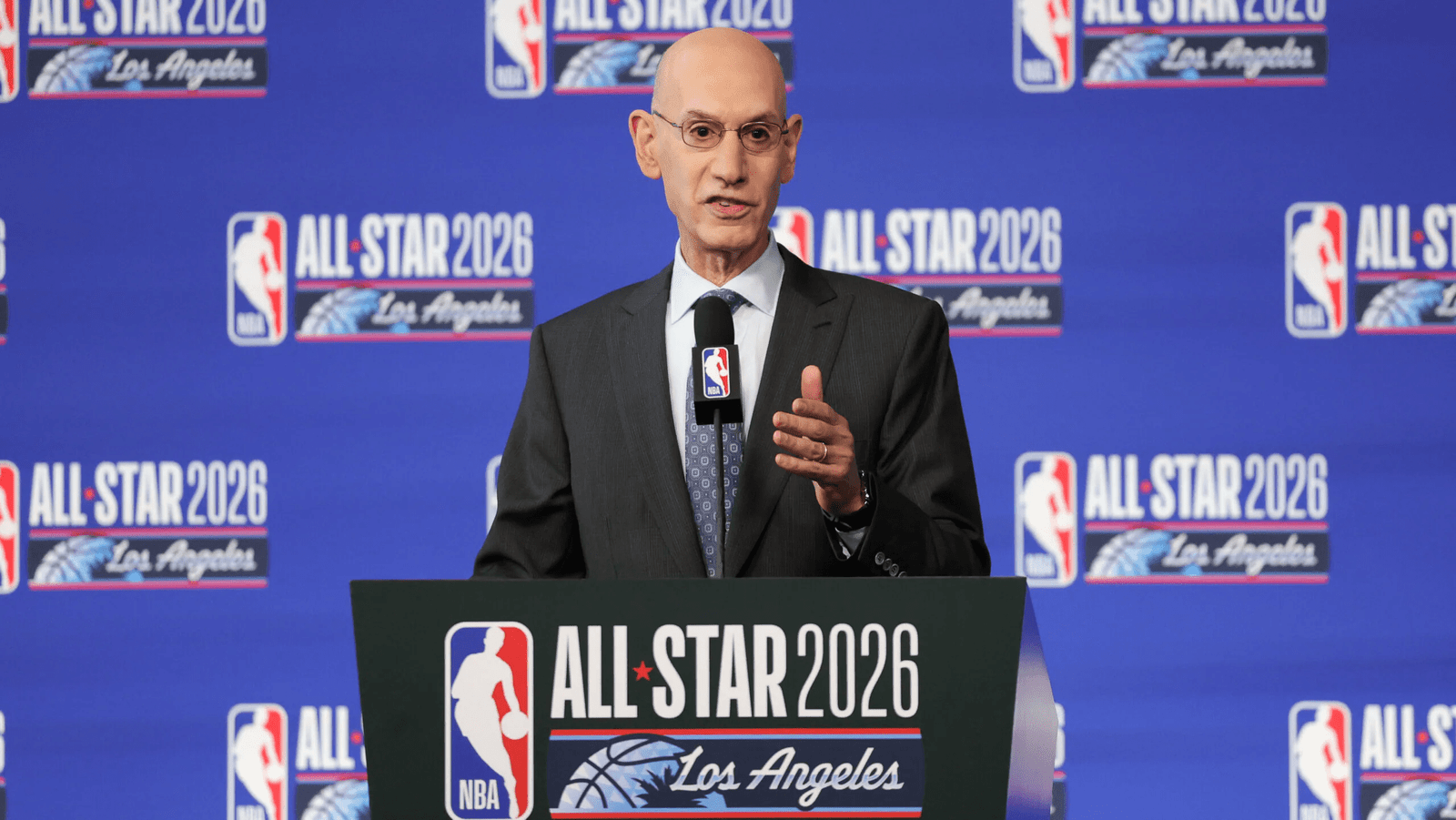 NBA Commissioner Adam Silver speaking at a press conference, waves and gestures while discussing potential league expansion with Seattle and Las Vegas mentioned as possible future teams